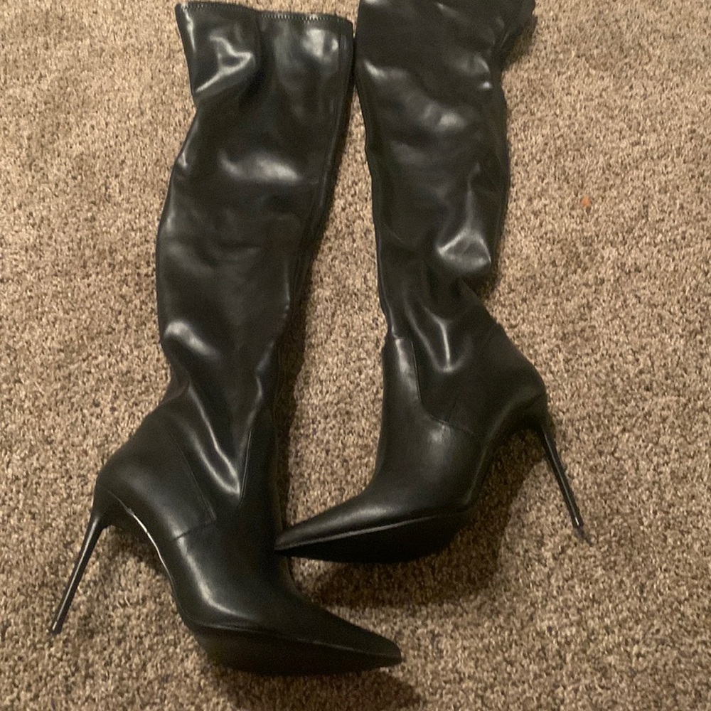 Never worn above the knee boots.